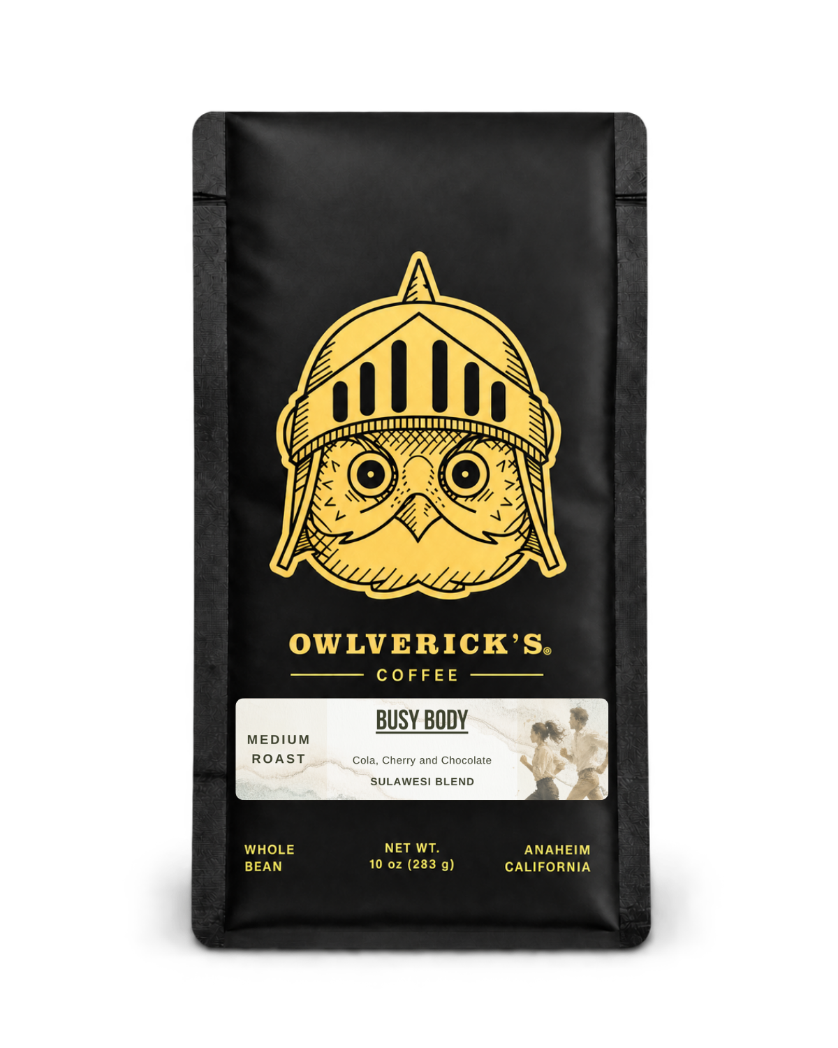 A black bag of Owlverick's Coffee 'Busy Body' medium roast whole bean coffee, featuring a gold owl in a helmet graphic on the front, set against a plain white background.