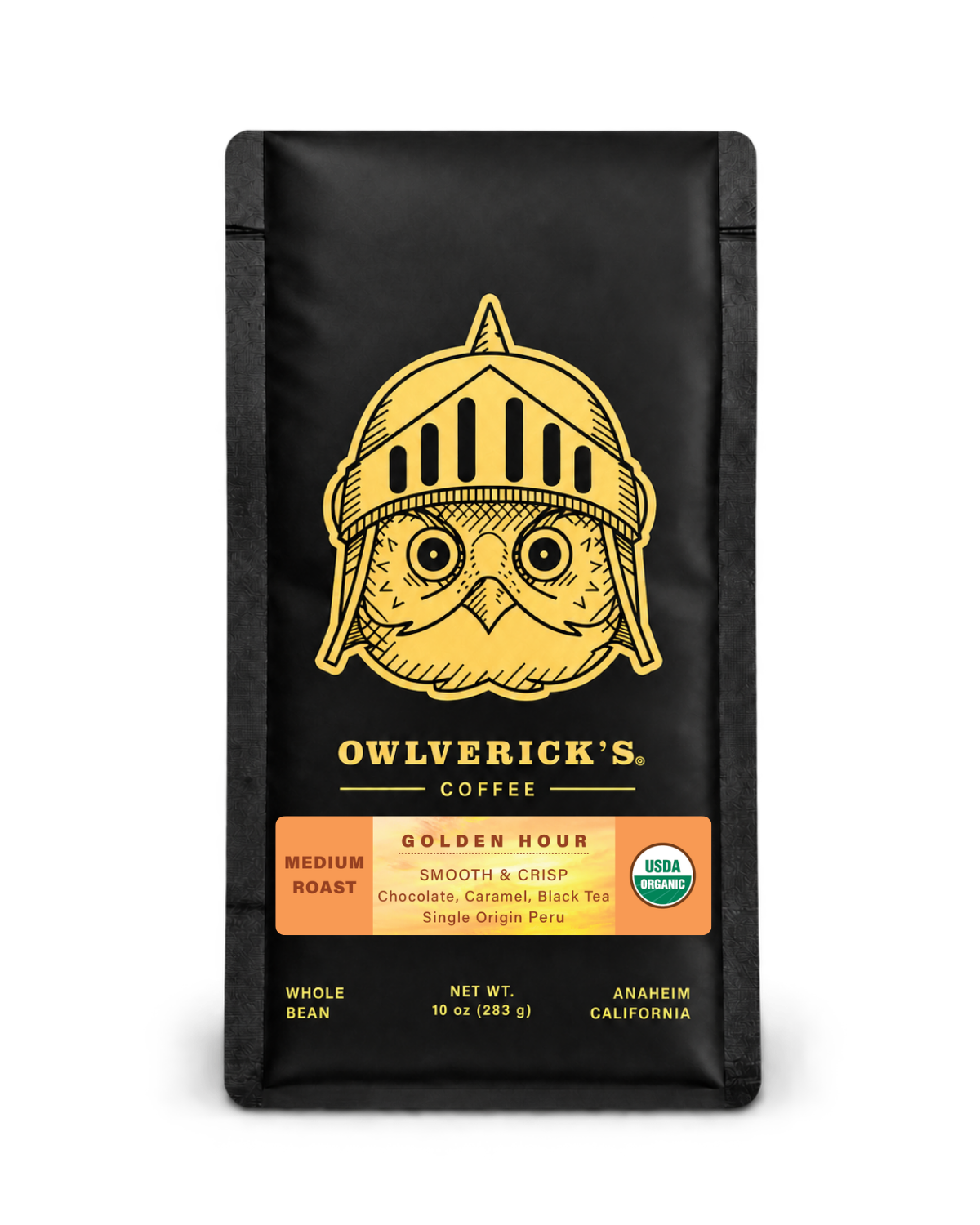 10 oz bag of Owlverick's Golden Hour Coffee in a matte black bag with a gold owl helmet logo and product details on the front, shown against a plain white background.