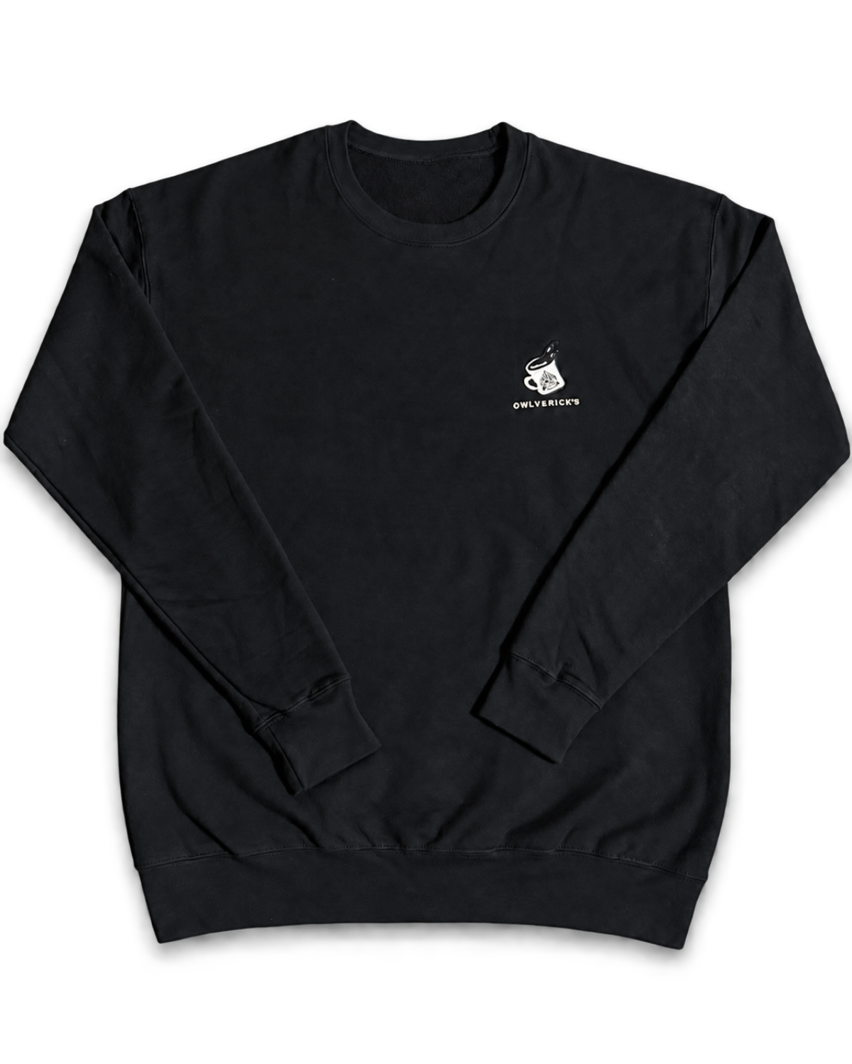 A black sweatshirt shown from the front, featuring a small emroidery of an illustrated coffee mug with the text 'OWLVERICK'S' on the left chest. 