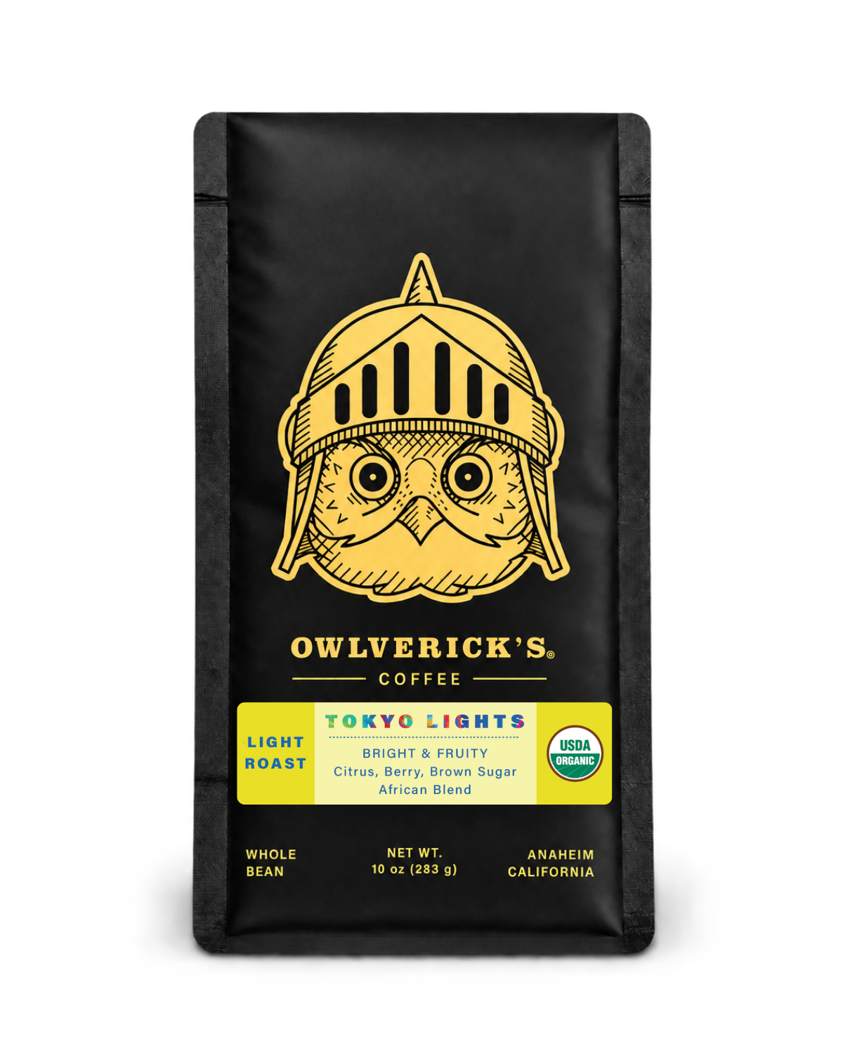 10 oz bag of Owlverick's Tokyo Lights Coffee in a matte black bag with a gold owl helmet logo and product details on the front, shown against a plain white background.