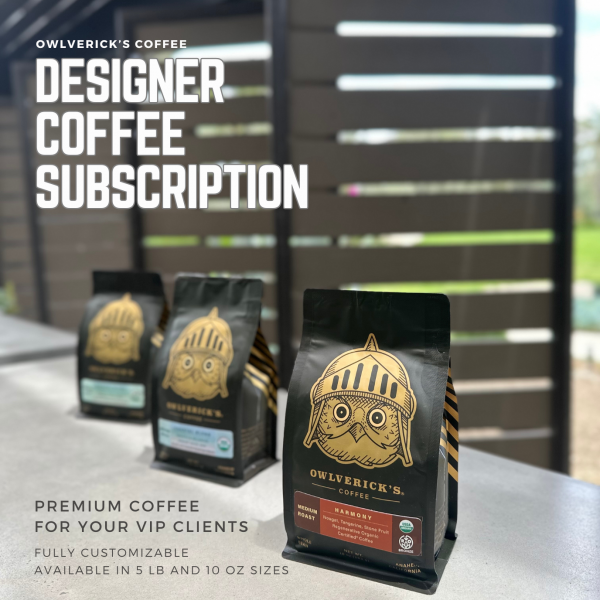 Image of 3 coffee bags in front of slatted wall. Text reads "Designer Coffee Subscription"