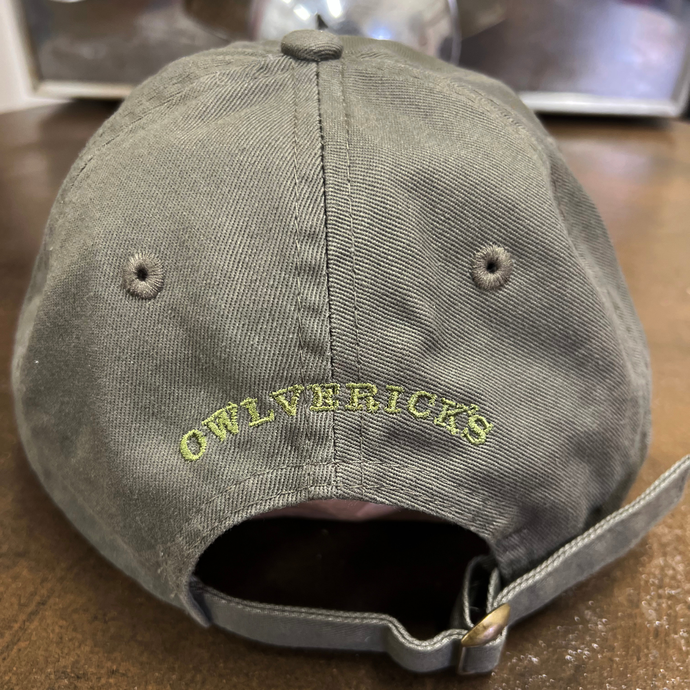 Back of dad hat in Green color with "Owlverick's" embroidery