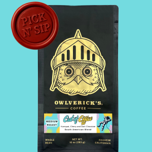 Front of Black Coffee Bag with Owl Design named Out of Office. Red stamp says "Pick N' Sip" to designate that this is for a pickup only product. Pickup is June 10, 2026 between 9am and 12pm.